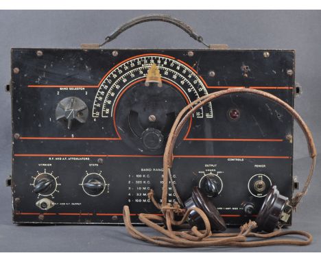A WWII Second World War period British Army field radio Signal Generator set, with original headphones. The radio set within 