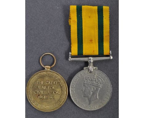 An original WWI First World War and WWII Second World War medal pair awarded to a Sister E Juke comprising Victory Medal and 