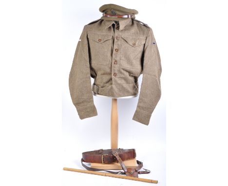 A collection of WWII Second World War British Army Royal Corps of Signals uniform items comprising a 1943 dated tunic with 1 