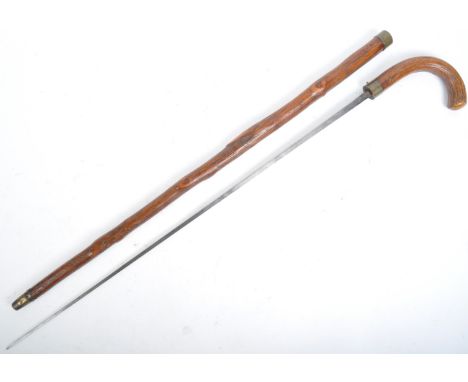 A 19th Century Edwardian gentleman's sword stick / walking stick cane with concealed stiletto blade. The wooden hook shaped h