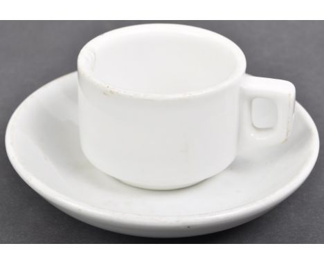 Two original WWII Second World War Third Reich Nazi German ceramic kitchen items comprising a cup and saucer. All white with 