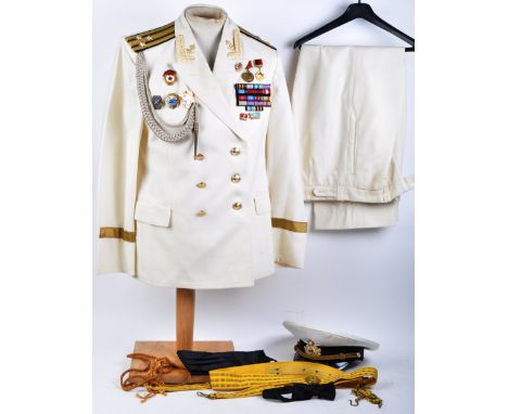 An original 20th century Soviet / Russian Navy / Naval uniform - appears complete, comprising; jacket, trousers, cap, belts e