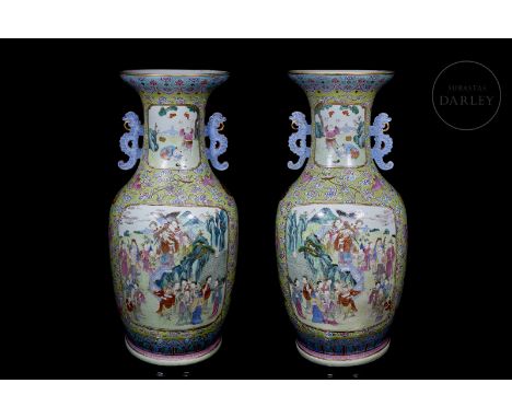 Two large porcelain vases, decorated with ‘famille rose’ enamels. They have a circular base and a balustraded profile that wi