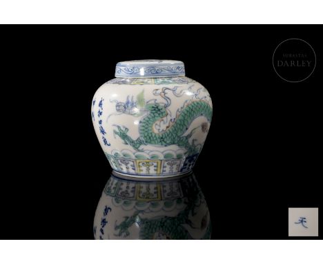 A lidded ‘Doucai’ porcelain jar with underglaze blue and overglaze coloured enamel decorations set on a pristine white backgr