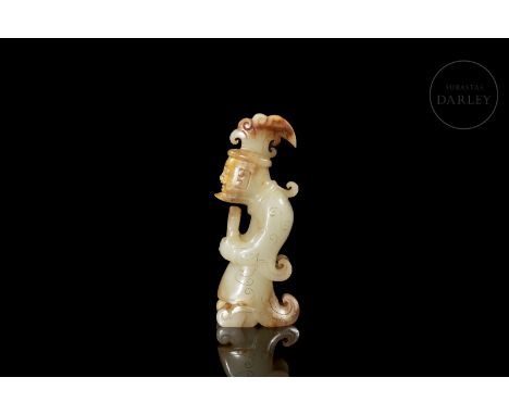 White jade with reddish and golden flecks. Carved in the form of a male figure, standing upright, with his back curved and hi