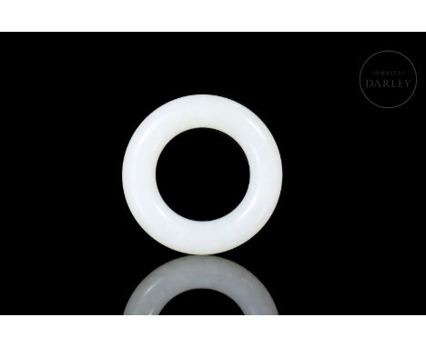 Carved white jade, ring-shaped, with rounded edges and a smooth textured surface.Outer diameter: 5.3 cm; Thickness: 1.06 cmWe