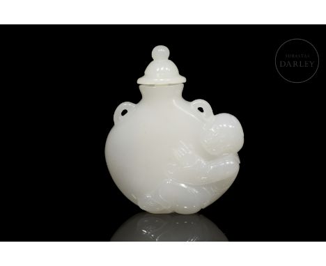 Carved Hetian jade, of a soft white colour. It is in the form of a ‘bianhu’ vase with a flattened, circular body, two small h
