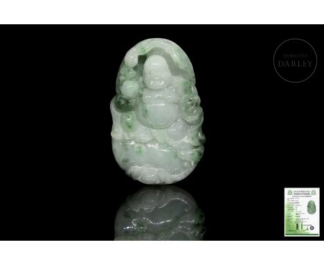 A small pendant of carved natural jadeite, elegantly light in colour with greenish flecks of varying degrees of intensity. It