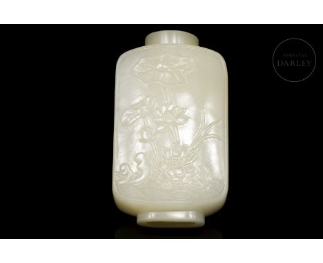 Hetian jade of a soft white colour, carved in the shape of a snuff-bottle. It has a rectangular, flattened body with rounded 