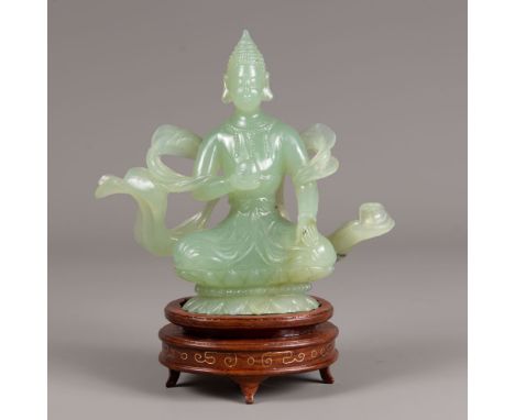 Bodhisatva, on lotus base with waved clothes, light green jade on wooden base, Qing Dynasty. 18 cm height