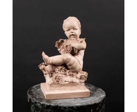 Ceramic sculpture, young boy with grapes and a bird, German early 20th Century, 25 cm height