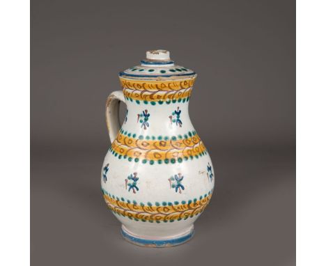 Slovakian ceramic jug, in pear shape, with one hand grip and spout, multicoloured painted on white ground, glazed; 1st half 1