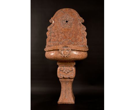Rosso Verona fountain, sculpted red marble with black and grey veins, in the centre half round basin with coat of arms an dra