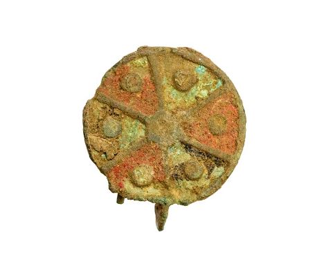 Roman, a virtually complete cast copper-alloy and enamel disc brooch dating to the 2nd century AD. The brooch is circular in 