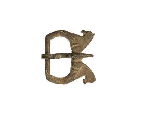 Roman, a complete copper-alloy single looped zoomorphic buckle of Hawkes and Dunning type 1b, dating c. AD 350-450. The buckl