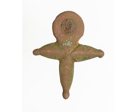 Roman, an incomplete copper-alloy plate brooch dating to the 1st or early 2nd century AD. The object is broadly cruciform in 