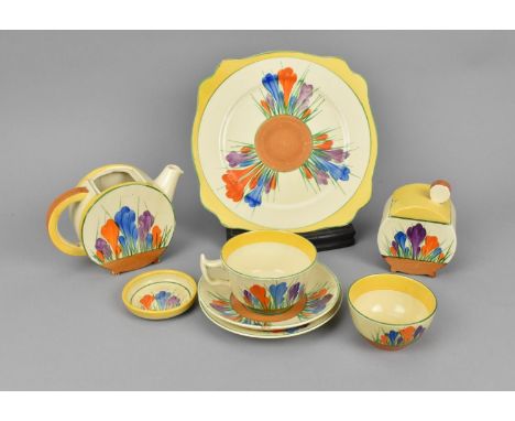 A Clarice Cliff Bonjour shape teapot in the Autumn Crocus pattern, without lid, together with a similar design lidded preserv