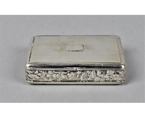 A George III silver snuff box by Daniel Hockley, London 1818, with engine turned detail to the lid and base and floral detail