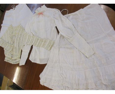 A selection of 19th century and early 20th ladies cotton and lace clothing to include undergarments, a Victorian cream croche