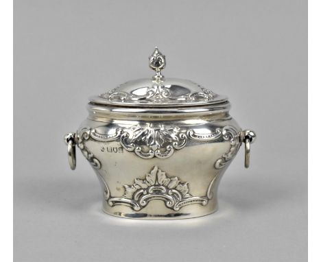 An Edward VII silver tea caddy by William Hutton & Sons, London, 1903, of bombe form with embossed c scrolls and hooped twin 