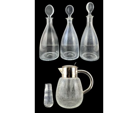 Three Strombergshyttan Swedish glass decanters with disc stoppers, two signed and number E109, H30cm max, Orrefors faceted cl