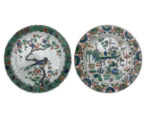Chinese famille verte 'antiquities' plate, Kangxi period, centrally decorated with precious objects, within a stylized border