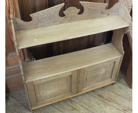 An Edwardian Pine hanging shelf with cupboard