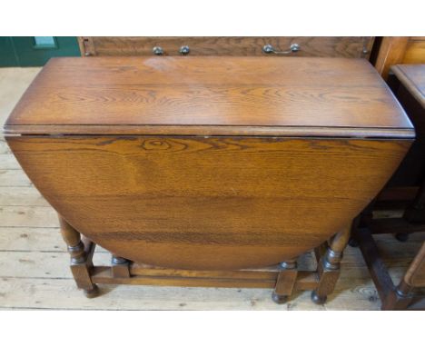 An Oak gate leg table and a Mahogany silk work screen