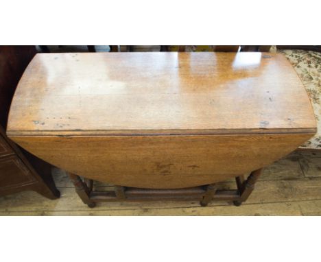 An antique Oak gate leg table
