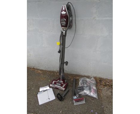 A SHARK ROCKET TRUE PET VACUUM CLEANER WITH VARIOUS TOOLS