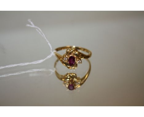 AN 18 CARAT YELLOW GOLD RUBY AND DIAMOND RING, the ruby being an estimated 0.30 carat, ring size O