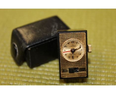 A RARE VINTAGE NEPRO MINISONIC MINIATURE ALARM CLOCK