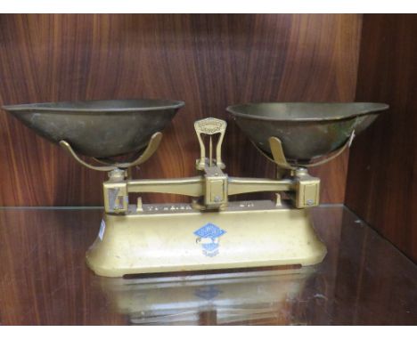 A SET OF GOLD PAINTED ASHWORTH SCALES 