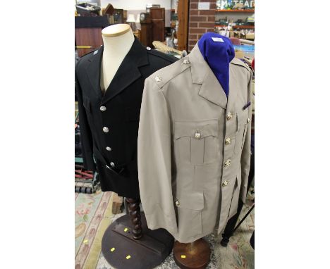 A WEST MIDLANDS ST JOHNS AMBULANCE UNIFORM ON TORSO MANNEQUIN, TOGETHER WITH&nbsp;A MAJORS TUNIC&nbsp; (2)