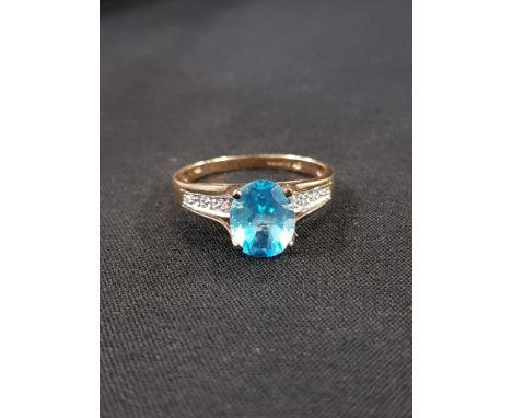 9CT GOLD BLUE STONE AND DIAMOND RING
