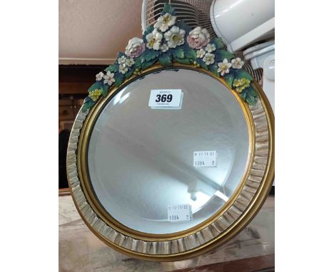 A small vintage Barbola dressing table mirror with bevelled circular plate and gilt easel back