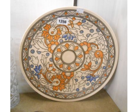 A large Charlotte Rhead Crown Ducal charger with tube-lined floral decoration
