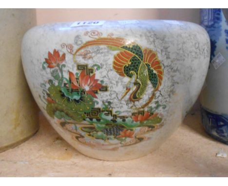 A ceramic jardiniere with transfer printed dragon decoration