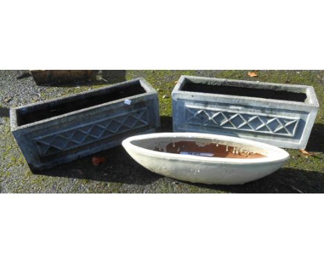 A pair of modern faux concrete oblong planters - sold with a glazed ceramic boat form similar