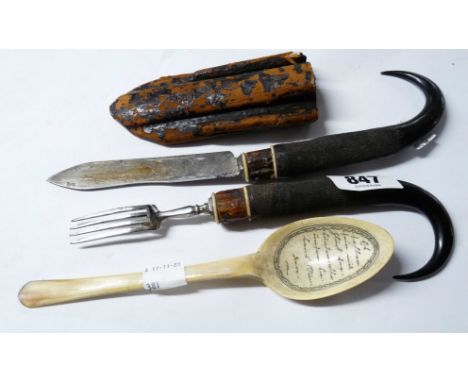 An antique Alpine region travelling cutlery set comprising goat horn handled knife and fork with carved cow horn spoon, the b