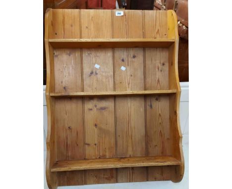 A 62cm pine wall hanging three shelf open spice rack