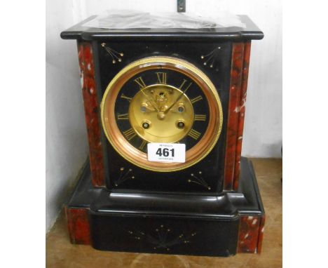 A late Victorian black slate and red marble cased mantel clock with visible escapement to dial centre and French eight day be