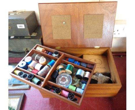 A vintage small tabletop lift-top sewing box and contents