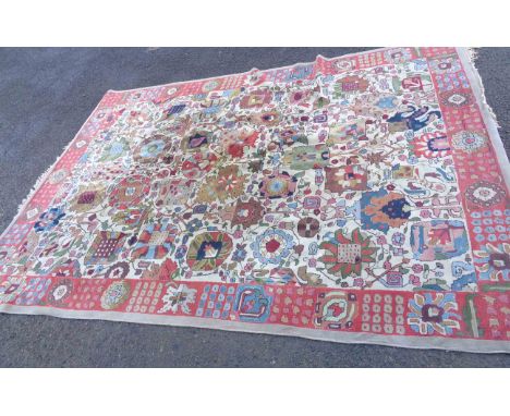 A vintage Connemara handmade wool rug with Arts and Crafts style floral and foliate decoration within a decorative border - o