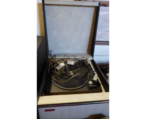 A vintage Cavalier portable record player with Garrard deck