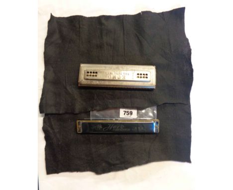 A Hohner harmonica - sold with a Hero similar