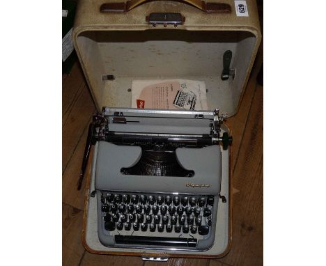 A vintage Olympia SM4 typewriter in hard carry case