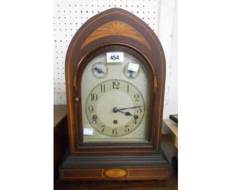 An Edwardian inlaid mahogany cased mitre shaped mantel clock with Kienzle eight day movement - other two trains detached, gon