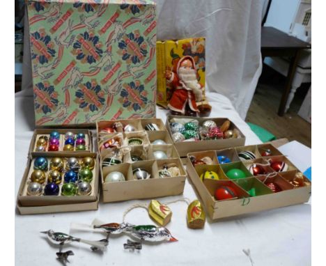 An old Tom Smith cracker box containing a quantity of vintage Christmas decorations including blown glass baubles, West Germa