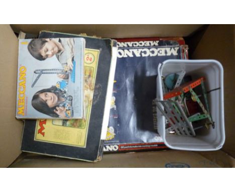 A box containing a quantity of old and vintage Meccano including part sets, etc.